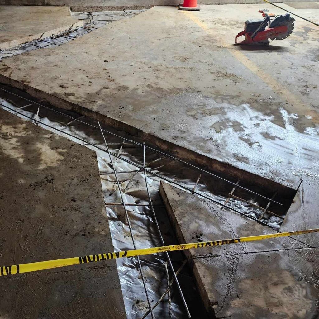 Precision concrete cutting and commercial demolition on an active site.