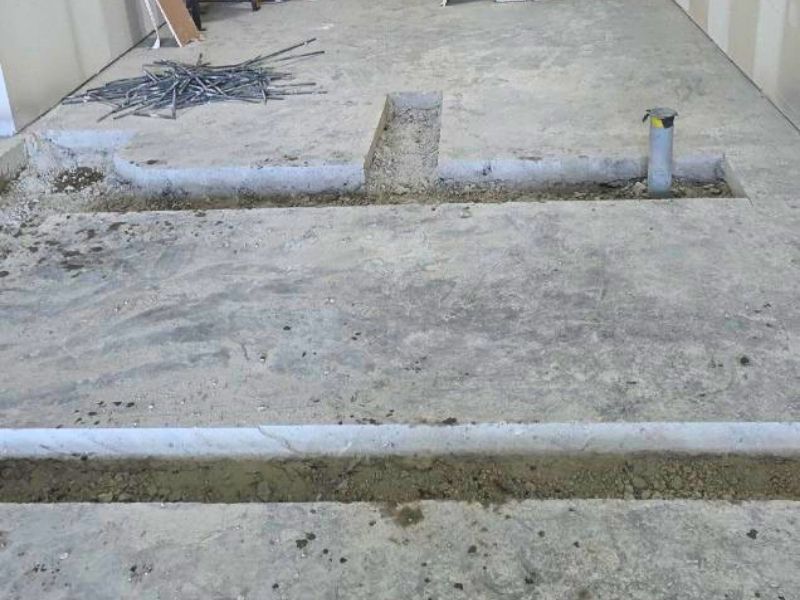 Indoor concrete trenching and slab cutting performed for utility installation in a new Edmonton commercial build