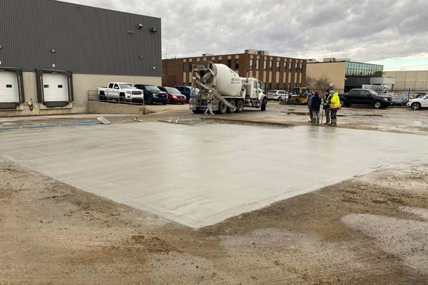 Heavy-duty concrete repair and section replacement in an Edmonton industrial trucking yard.
